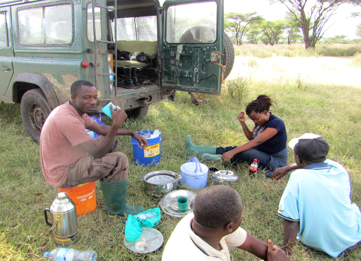My team having breakfast in Serengeti National Park during preliminary survey 2016. From left; James, (field assistant) Selemani (driver), Greyson and Evelyne (Research officer) Photo; Monica Shilereyo, 2016